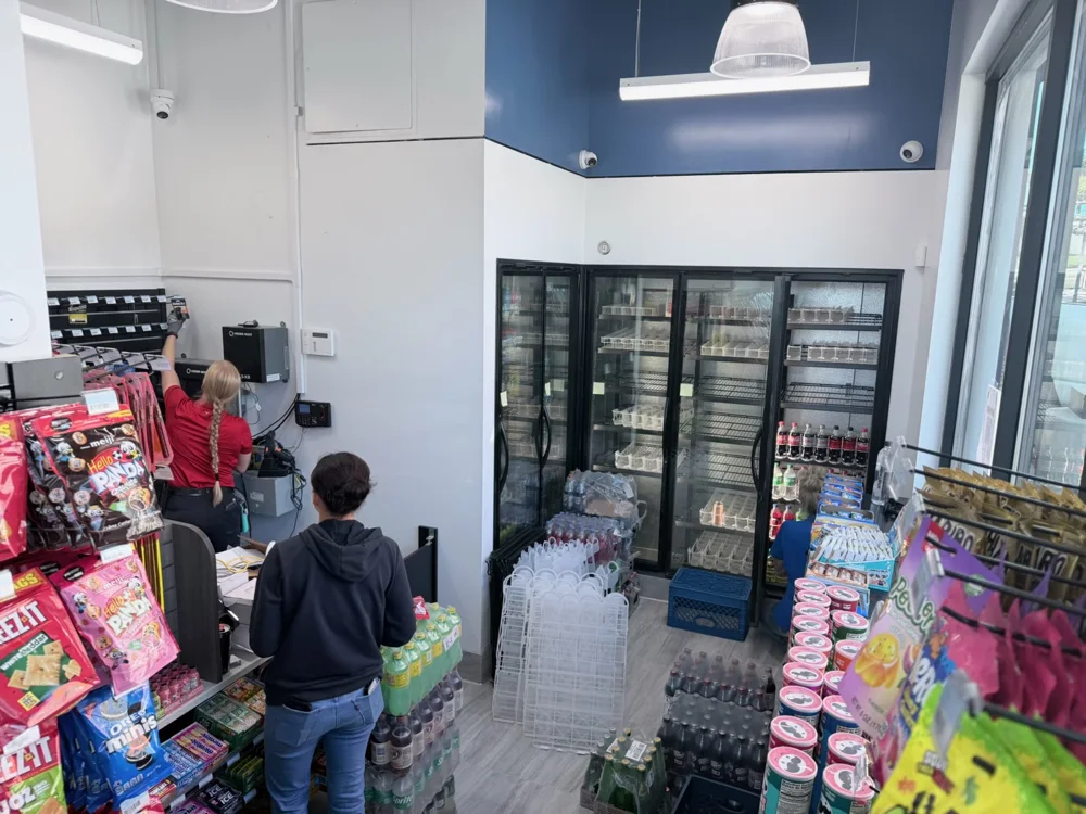 Snacks and refrigerated drinks inside the Magic Mart convenience store